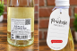 Preview: Rückseite der Geschenkflasche mit Produktinformationen und Geschenkanhänger